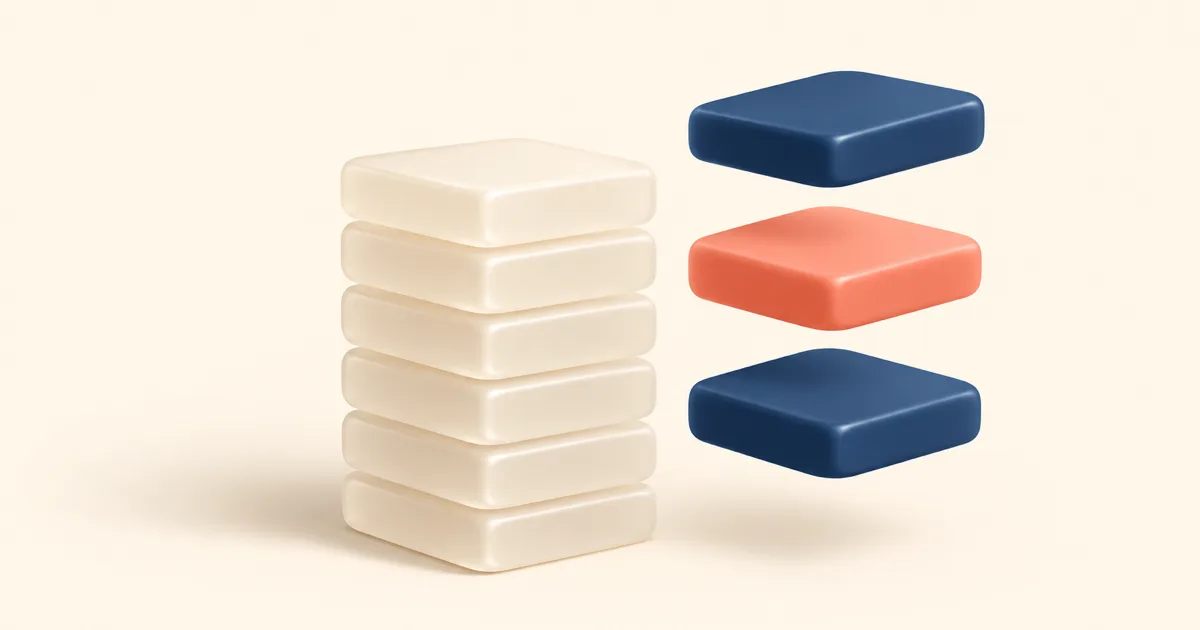 A stack of six cream tiles with two navy tiles and one coral tile lifted out and floating beside it, on a flat cream background.